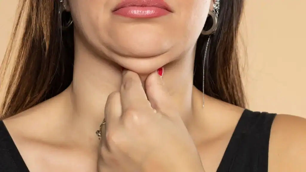 An image of a woman with double chin, sad, worried : Non Surgical Double Chin Removal Treatment in Sutton, UK